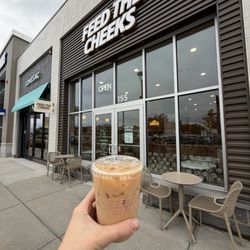 Feed The Cheeks - Outdoor seating and a chai latte