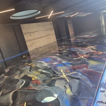 402 Resins - Metallic epoxy in action on this eighteen hundred square foot floor. Client wanted the floor to match the colors of his porsches - Flooring Near Me - Omaha, Nebraska 402 Resins - Metallic epoxy in action on this eighteen hundred square foot floor. Client wanted the floor to match the colors of his porsches - Flooring Near Me - Omaha, Nebraska