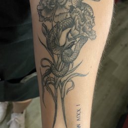 Carnation tattoo with birthdate and snake. Carnation tattoo with birthdate and snake.