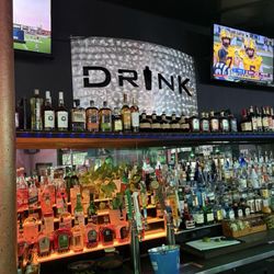 Drink Texas - Sign behind the bar