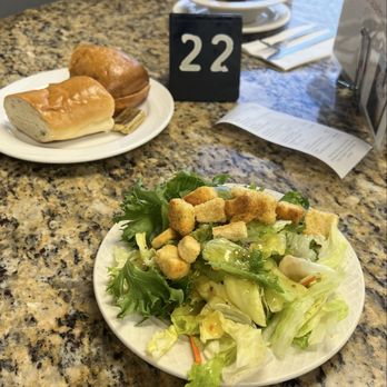 Golden Ox Diner - Salad dish filled Italian dressing sauce & pieces of hard salt cookies, Plain bread with a piece of butter near the salad dish - Diners Near Me - Lodi, California Golden Ox Diner - Salad dish filled Italian dressing sauce & pieces of hard salt cookies, Plain bread with a piece of butter near the salad dish - Diners Near Me - Lodi, California