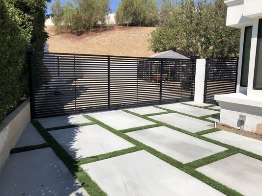 Driveway Gates - At Haas Metal Designs all of our wrought iron gates and fences are custom designed to provide security and beauty to any home. Our residential security gates and fences can be custom designed to match the unique style of your home with the added advantage of being both durable and decorative. Each gate and fence is built to withstand weather, extreme sun or extreme cold.