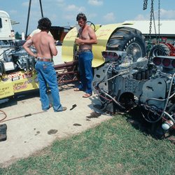 RECREATION PARK - Men busy assembling their tractor, prior to event in Tomah, WI.