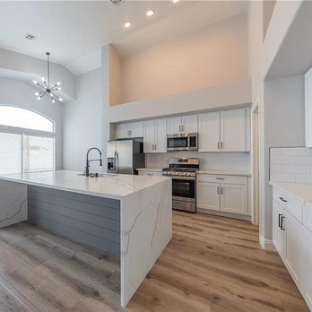 California Cabinets Distributor - a large kitchen with a center island - Flooring Near Me - Henderson, Nevada