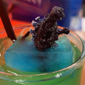 Susuru - A little Godzilla figuring in my cocktail! - Izakaya Near Me - Orlando, Florida Susuru - A little Godzilla figuring in my cocktail! - Izakaya Near Me - Orlando, Florida