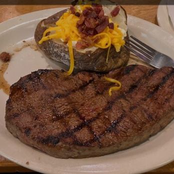 Texas Roadhouse - The 18 oz sirloin with loaded baked potato and side salad. - Steakhouses Near Me - Oviedo, Florida Texas Roadhouse - The 18 oz sirloin with loaded baked potato and side salad. - Steakhouses Near Me - Oviedo, Florida