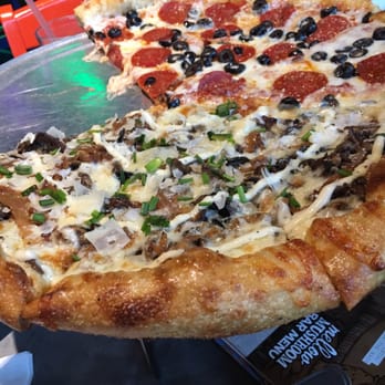 Mellow Mushroom - Half pepperoni and olives and half Holy Shiitake Pie - Pizza Near Me - McKinney, Texas