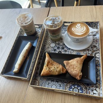 Qamaria Coffee - Pistachio Latte, Qamaria latte, egg and cheese, chicken Fatayer, and chicken musakhan. - Coffee & Tea Near Me - Fullerton, California