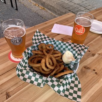 Brass Monkey Local - onion rings and beer on a picnic table - Chicken Wings Near Me - St. Catharines, Ontario