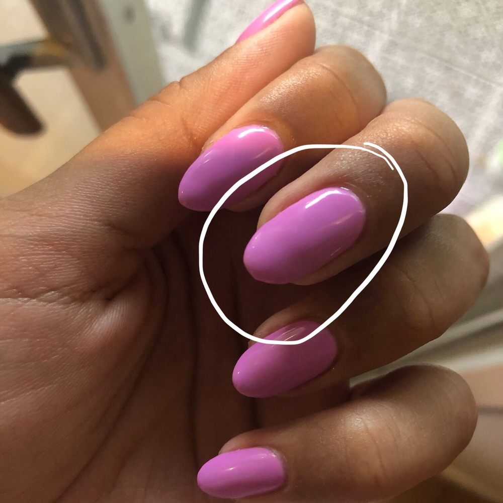 I don't even know what the heck happened when she was shaping this nail. No attention to detail