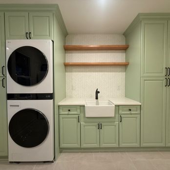 Fixquisite - Finished laundry wall with custom-painted cabinetry, quartz countertop, farmhouse sink, and solid wood floating shelves. - Handyman Near Me - Spokane, Washington Fixquisite - Finished laundry wall with custom-painted cabinetry, quartz countertop, farmhouse sink, and solid wood floating shelves. - Handyman Near Me - Spokane, Washington