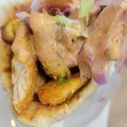 Kalita style chicken gyro. Lettuce, fries, red onion, pepperoncinis and spicy sauce