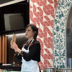 Maite cooking one of the recipes in Josefina's cookbook