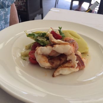 Sails Restaurant Noosa - Main Course of Pancetta wrapped Moreton Bay Bug tails on a bed of olive oil potato mash with butter beans and fetta dressing - Seafood Near Me - Noosa Heads, QLD