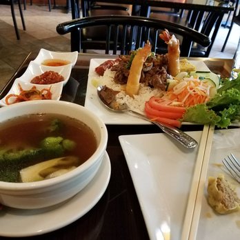 Saigon Saigon - Imperial rice, pictured with half a ha gow from an appetizer - Vietnamese Near Me - Arlington, Virginia