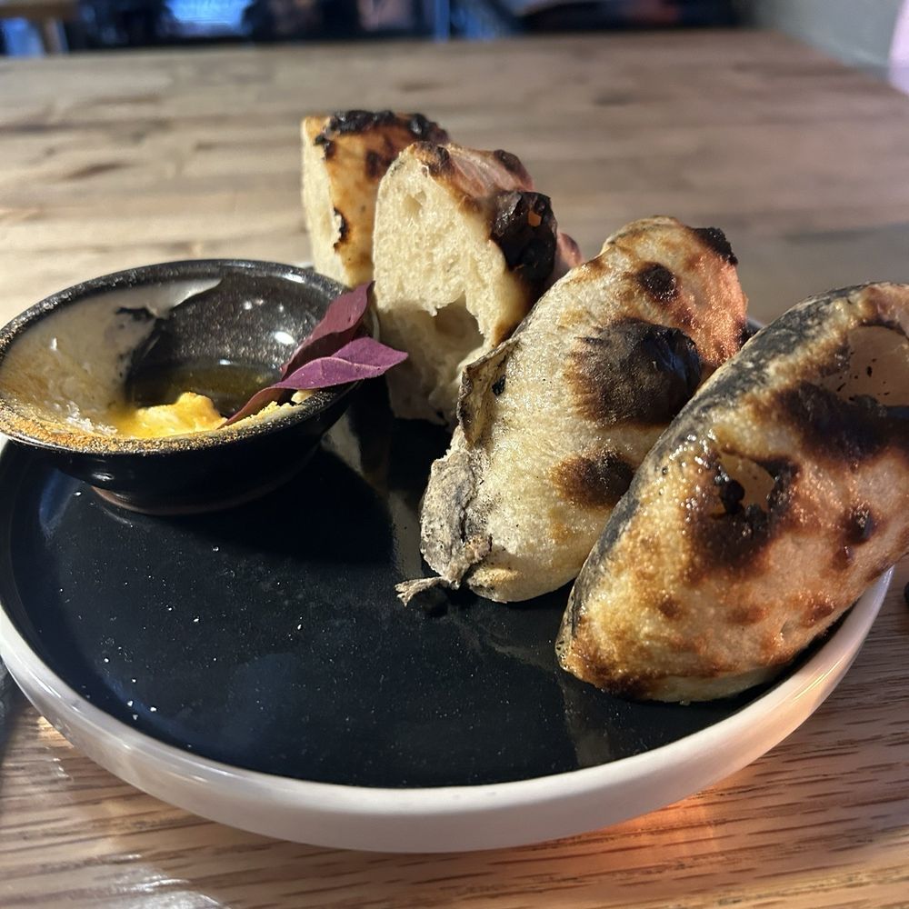 Brutø - I am an outlier here - but this bread was too doughy. The guy next to me at our bread. The butter was good. - Tapas/Small Plates Near Me - Denver, Colorado Brutø - I am an outlier here - but this bread was too doughy. The guy next to me at our bread. The butter was good. - Tapas/Small Plates Near Me - Denver, Colorado