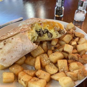 Cross Grain Brew House - Breakfast burrito with sausage egg and cheese in perfect proportion, side potatoes. - New American Near Me - Richmond, Virginia Cross Grain Brew House - Breakfast burrito with sausage egg and cheese in perfect proportion, side potatoes. - New American Near Me - Richmond, Virginia
