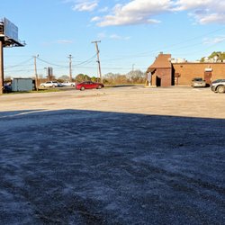 Petee's Drive In - Looking from the truck parking lot empty for a Friday for now up to watch the back of the building u.s. 25 very busy and car lot