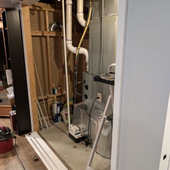Secret Doorways - Before-unsightly sump pump was covered by folding doors - Door Sales/Installation Near Me Secret Doorways - Before-unsightly sump pump was covered by folding doors - Door Sales/Installation Near Me