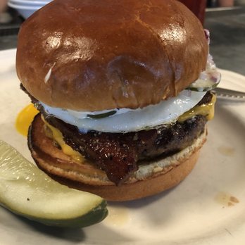Au Cheval - Single with egg and bacon after assembled! I surprisingly thought it tasted better without the bacon! One of the best burgers I've had! - Bars Near Me - Chicago, Illinois