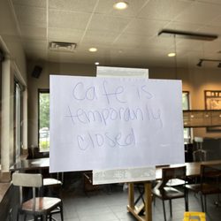 Starbucks - Closed sign on front door, drive through is blocked.