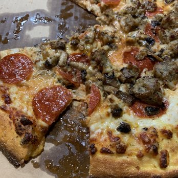 Domino's Pizza - a half eaten pizza in a box - Pizza Near Me - Castle Rock, Colorado