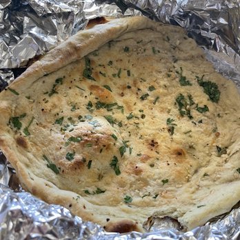 Roopa's Kitchen - Garlic naan - Indian Near Me - Temple, Texas