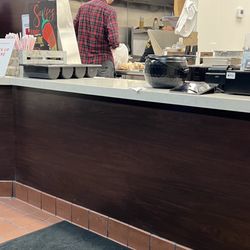 Comelones Tacos - Guy who works there enjoying a taco with his bare hands while handling my food.