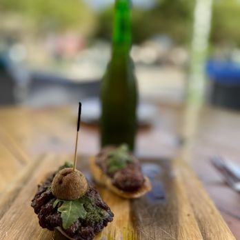 Patio Tapas and Beer - two appetizers on a wooden table - Tapas/Small Plates Near Me - Boca Raton, Florida Patio Tapas and Beer - two appetizers on a wooden table - Tapas/Small Plates Near Me - Boca Raton, Florida