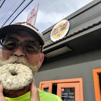 Donut Dynamite - Lonny (@donutduster) posing with mint brioche donut at Donut Dynamite in Maui. - Donuts Near Me - Wailuku, Hawaii Donut Dynamite - Lonny (@donutduster) posing with mint brioche donut at Donut Dynamite in Maui. - Donuts Near Me - Wailuku, Hawaii