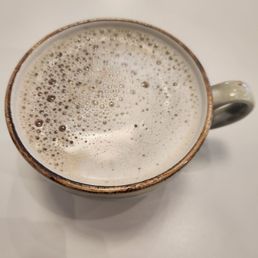 Coffee with a splash of Oat Milk. Coffee with a splash of Oat Milk.