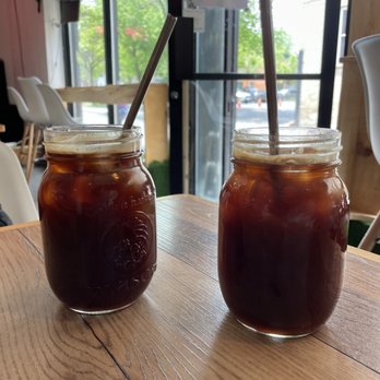 Café Tuyo - two jars of iced coffee on a table - Vegan Near Me - Montreal, Quebec Café Tuyo - two jars of iced coffee on a table - Vegan Near Me - Montreal, Quebec