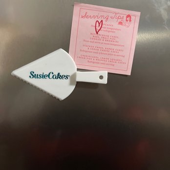 SusieCakes - Dallas - They have a magnet that is shaped like a cake cutter and next to it there is the serving tips sticky note. - Bakeries Near Me - Dallas, Texas SusieCakes - Dallas - They have a magnet that is shaped like a cake cutter and next to it there is the serving tips sticky note. - Bakeries Near Me - Dallas, Texas