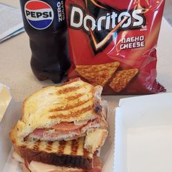 Speedway - 1/11/24 turkey bacon Swiss panini Add a little tomato honey mustard Bottle of Pepsi Zero bag of chips