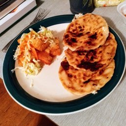 Cheese pupusas with a side of yuca fritas. Cheese pupusas with a side of yuca fritas.
