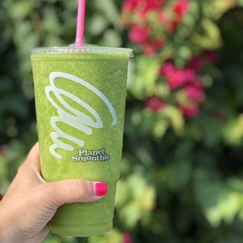 Planet Smoothie - a hand holding a green smoothie - Juice Bars & Smoothies Near Me - Wesley Chapel, Florida Planet Smoothie - a hand holding a green smoothie - Juice Bars & Smoothies Near Me - Wesley Chapel, Florida