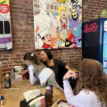 Taglio Pizza - Kids love pizza and climbing on tables - Pizza Near Me - Mineola, New York