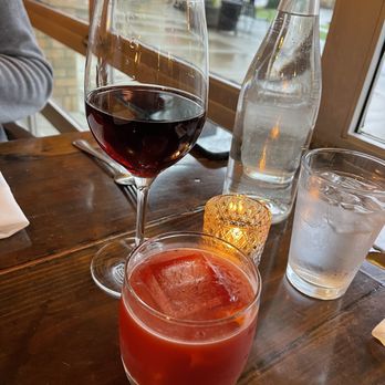 MiNGO - a glass of red wine and a glass of water on a table - Italian Near Me - Beaverton, Oregon MiNGO - a glass of red wine and a glass of water on a table - Italian Near Me - Beaverton, Oregon