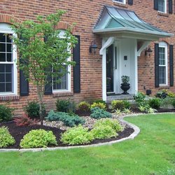 Earthscapes & Construction - Beautiful front landscaping with natural stone edging
