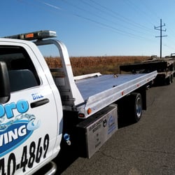All Pro Towing and Recovery - Hauling broken equipment trailers for a stranded account.