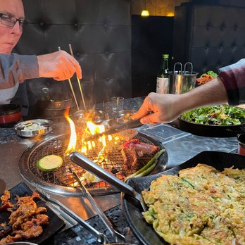 Old Village - Couldn't help myself from sampling the meat while it was cooking. - Korean Near Me - Seattle, Washington