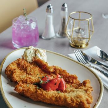 Budapest Bisztro - a plate of breaded fish and vegetables - Bistros Near Me - Halifax, Nova Scotia Budapest Bisztro - a plate of breaded fish and vegetables - Bistros Near Me - Halifax, Nova Scotia