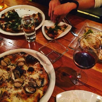 Pizzeria Toro - Pizza with claims, sausage and kale pizza..the perfect complimentary red wine - Pizza Near Me - Durham, North Carolina