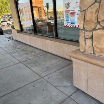 Del Taco - a storefront window with a sign on it - Mexican Near Me - Palm Desert, California