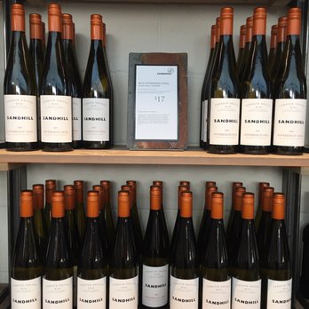 Sandhill Estate Winery - a shelf of wine bottles - Wineries Near Me - Kelowna, British Columbia Sandhill Estate Winery - a shelf of wine bottles - Wineries Near Me - Kelowna, British Columbia