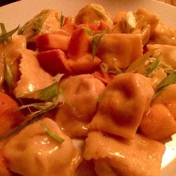 Wild Olive - Agnolotti with ricotta, prosciutto, peach sugo, and scallions (seasonal). So good! - Italian Near Me - Johns Island, South Carolina