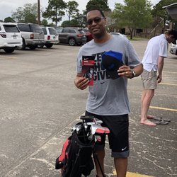 Clear Creek Golf Club - My golf coach had gifts for me today. He thinks I could be the next Tiger Hood!!! That's not my golf coach behind me.
