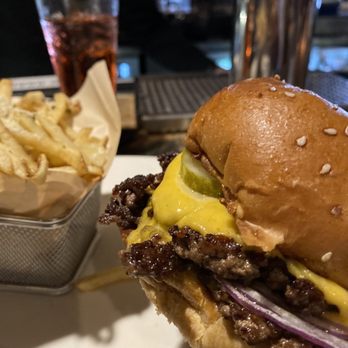 Stoney River - Stacked Cheeseburger* and Parmesan Fries with a Shirley temple - Steakhouses Near Me - Nashville, Tennessee Stoney River - Stacked Cheeseburger* and Parmesan Fries with a Shirley temple - Steakhouses Near Me - Nashville, Tennessee