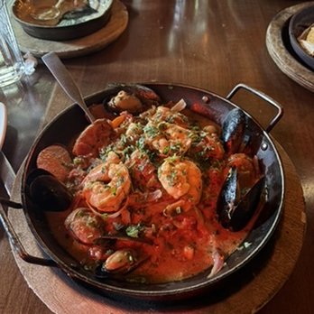 Iron Cactus San Antonio - Jumbo shrimp, mussels, bay scallops, roasted poblanos, and jalapeño Texas sausage in lobster cream over cilantro-lime rice. - Mexican Near Me - San Antonio, Texas