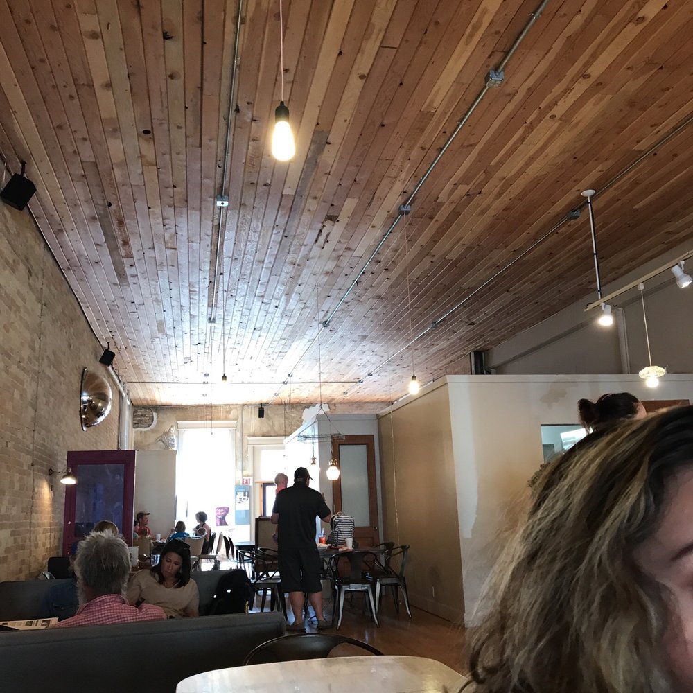 Sweetwater Coffee - a woman sitting at a table - Coffee & Tea Near Me - Dillon, Montana Sweetwater Coffee - a woman sitting at a table - Coffee & Tea Near Me - Dillon, Montana